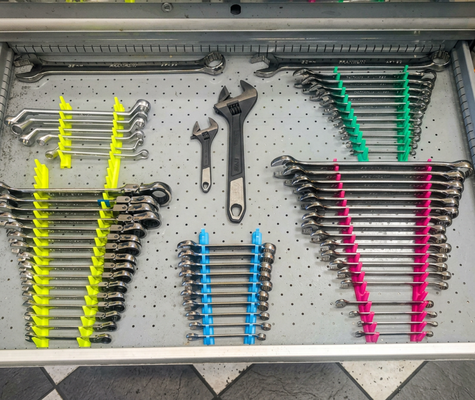 Modular spanner organisers available in multiple colours including red, blue, green and purple.