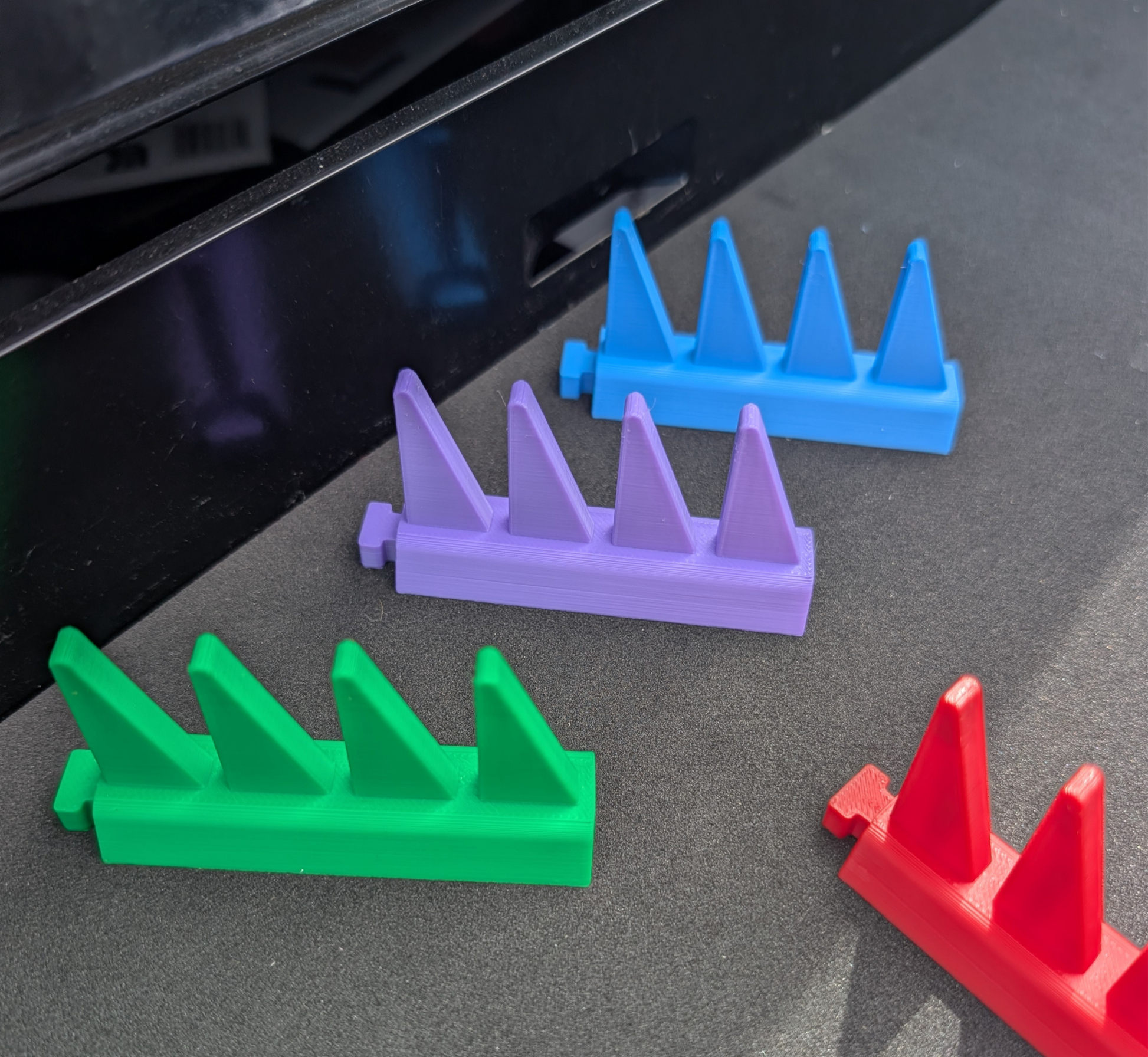 Stepped modular spanner organiser design providing easy access and visibility of spanner sizes in a toolbox drawer.